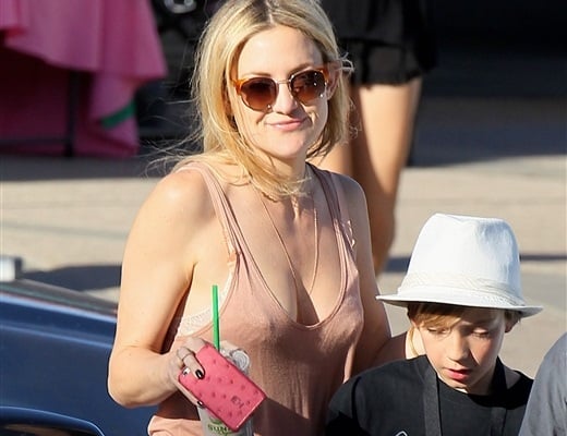 Actress Kate Hudson thrusts her hard nipples into the face of her