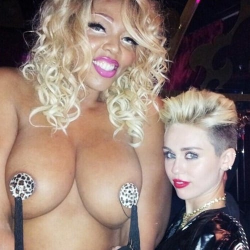 Miley Cyrus Poses With A Topless Beyonce