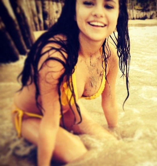 Selena Gomez Washes Up On Shore In A Yellow Bikini