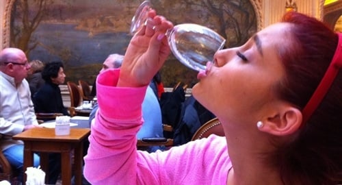 Ariana Grande drinking