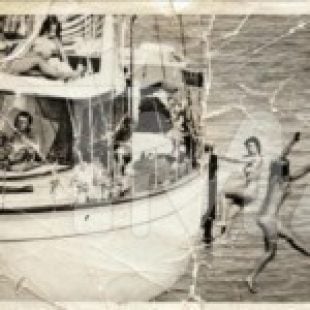 John F. Kennedy On A Boat Filled With Naked Women