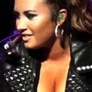 Demi Lovato Flexes Her Cleavage Vid