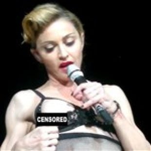 Madonna Flashes Her Boob In Concert