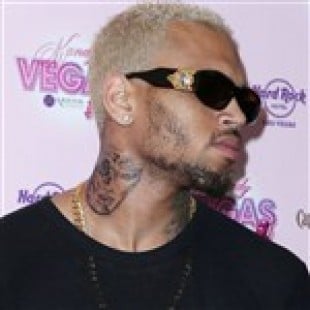 Chris Brown Gets A Tattoo Of Rihanna’s Beaten Up Face