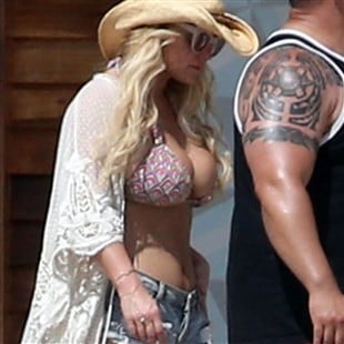 Jessica Simpson Stuffs Her Massive Boobs Into Tiny Bikini Top